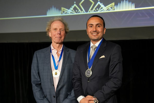 Dr Abdelghani awarding Prof John Rothwell the CTMSS Medal of Honour